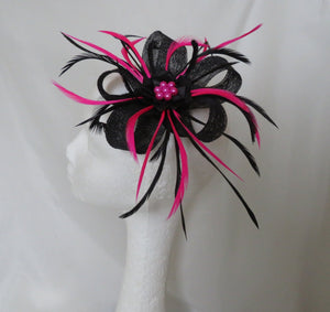 hot pink and black feather wedding fascinator on a headband