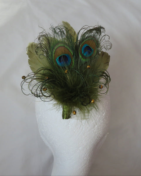 Peacock feather hair clip on a mannequin head against a white background