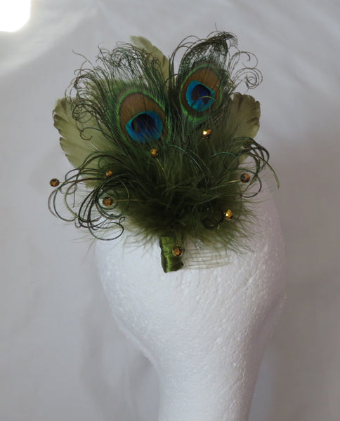 Peacock feather boutonniere on a white mannequin