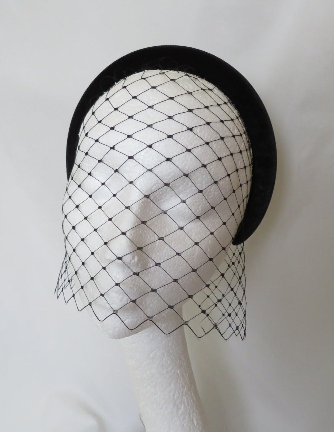 a separates set of an elegant black velvet halo headband and a black merry widow veil which has one comb which you place at your crown and them pop the headband on top, tucking the sides in, please note the veil is not attached