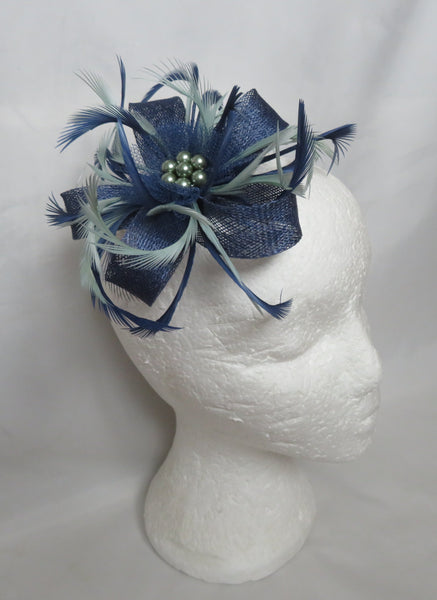french navy and sage green feather and sinamay fascinator with loops