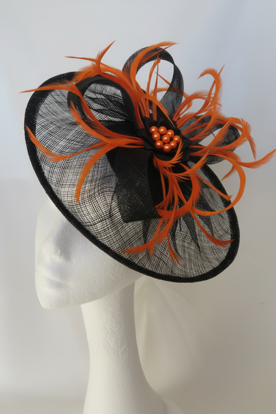 Black fascinator with bright orange feathers and orange pearl beads