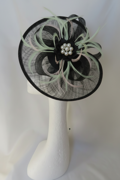 Black fascinator with pale green and rose pink feathers and mixed pearls