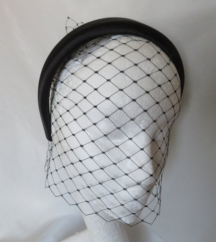 black satin padded headband with a separate veil attach the veil into your hair at the crown and put the headband on top you can also wear the two pieces separately on other occasions please note the veil is not attached to the headband
